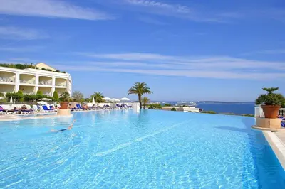 a large swimming pool with a person in the water at Le cannois in Cannes