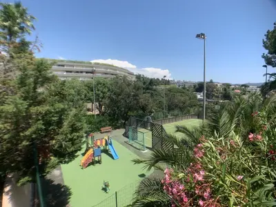 a playground in a park with a slide at Le cannois in Cannes