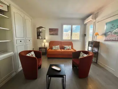 a living room with two chairs and a couch at Le Petit Magellan by Welcome to Cannes in Cannes
