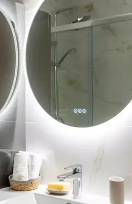 a bathroom with a mirror and a sink at Luxurious 3Bedroom 2 BATH 110 m Apartment Adjoining Hotel Martinez Beachfront in Cannes
