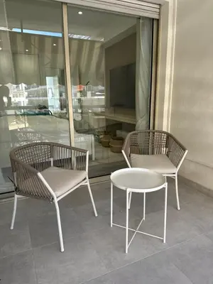 two chairs and a table in front of a window at Luxurious 3Bedroom 2 BATH 110 m Apartment Adjoining Hotel Martinez Beachfront in Cannes