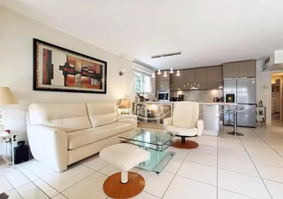 a living room with a couch and a table at Viva Riviera -14 Avenue Isola Bella in Cannes