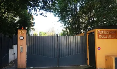 a blue gate with a fence and a sign at Viva Riviera -14 Avenue Isola Bella in Cannes