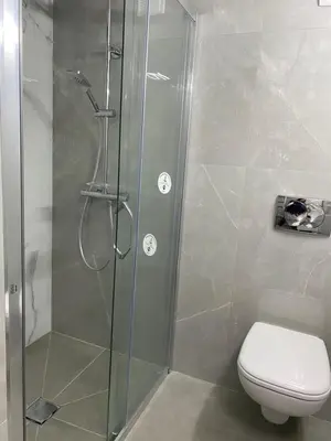 a bathroom with a shower and a toilet at Bas de villa prestations haut de gamme in Vallauris
