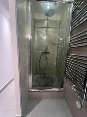 a shower with a glass door in a bathroom at Cannes, Loft 6 couchages proche centre et plages in Cannes