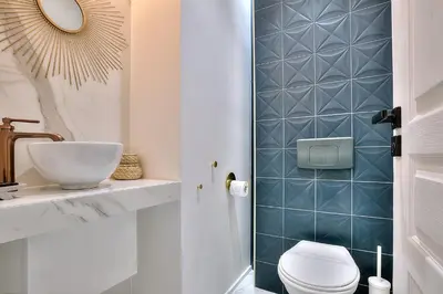 a bathroom with a toilet and a sink at FAR5 - 3 chambres à deux pas de la rue d'Antibes in Cannes