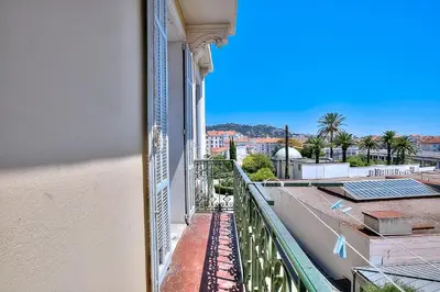 a balcony with a view of a city at FAR5 - 3 chambres à deux pas de la rue d'Antibes in Cannes