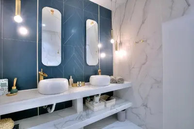 a bathroom with two sinks and two mirrors at FAR5 - 3 chambres à deux pas de la rue d'Antibes in Cannes