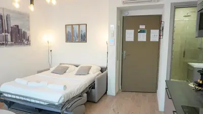 a hospital room with a bed and a bathroom at Proche Carlton & Croisette, Appartement 303 in Cannes