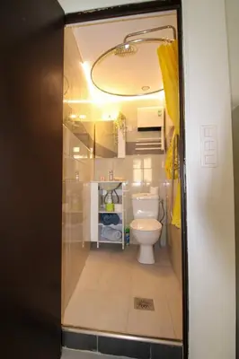 a bathroom with a white toilet in a room at Le Borniol ! Idéal ! Congrès! Central! lumineux! in Cannes