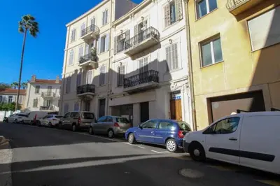 a row of cars parked in front of a building at Le Borniol ! Idéal ! Congrès! Central! lumineux! in Cannes
