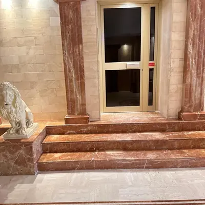 a building with a lion statue in front of a door at 2P Between Croisette Beaches and Antibes Street in Cannes