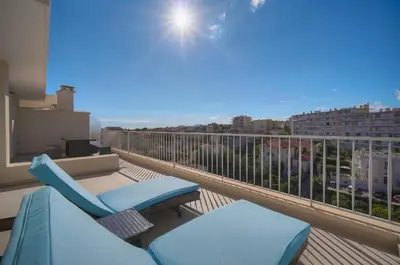 a balcony with chairs and a view of a city at Coco - Spacieux - Luxueux - VCA in Cannes