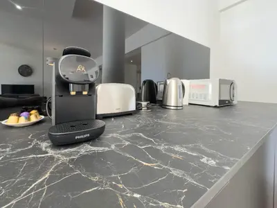 a coffee machine sitting on a counter in a kitchen at Le Montfleury by Winsome Destination in Cannes