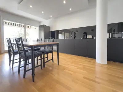 a kitchen and dining room with a table and chairs at Le Montfleury by Winsome Destination in Cannes