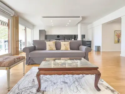 a living room with a couch and a coffee table at Le Montfleury by Winsome Destination in Cannes
