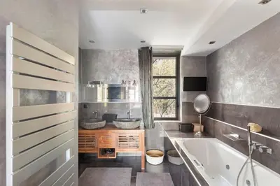 a bathroom with a tub and a sink at Villa avec piscine à Cannes 7 bedrooms in Le Cannet