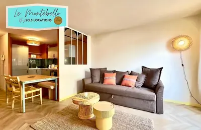 a living room with a couch and a table at Le Montébello By SCLS Locations in Cannes