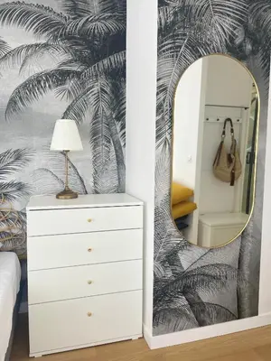 a bedroom with a white dresser and a mirror at Studio Stella in Cannes
