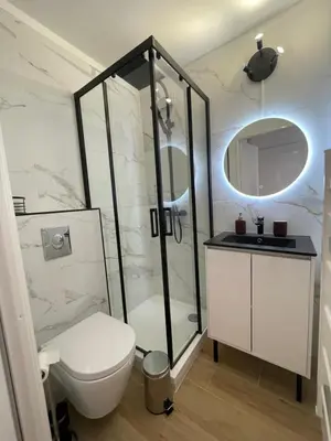 a bathroom with a shower and a toilet and a sink at Studio Stella in Cannes