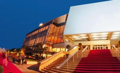 a building with a red staircase in front of a building at Studio Stella in Cannes