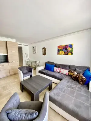 a living room with a couch and a table at Elegant studio MEN5335 in Cannes