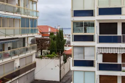 an apartment building with balconies in a city at L'Hippocampe du Palm Beach in Cannes