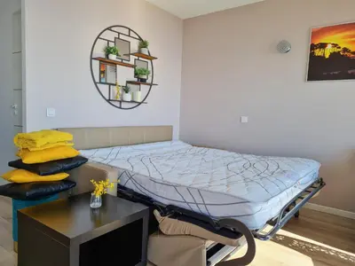 a bed in a room with a desk and a bed sidx sidx sidx at Western Cannes - Panoramic View in Cannes