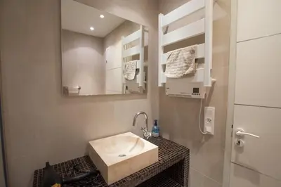 a bathroom with a sink and a mirror at Western Cannes - Panoramic View in Cannes