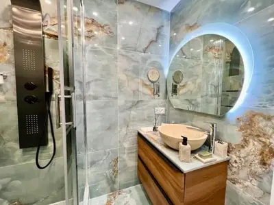 a bathroom with a sink and a shower at Grande terrasse vue dégagée mer en Basse Californie in Cannes