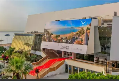a large billboard on the side of a building at Le 66 Carnot in Cannes
