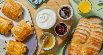 a table topped with plates of pastries and other foods at Le 66 Carnot in Cannes