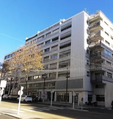 a large white building with scaffolding on the side of it at Le 66 Carnot in Cannes