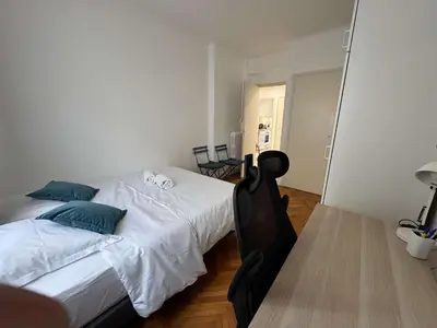 a bedroom with a bed with two pillows on it at C070 Magnifique appartement au calme 2 Chambre centre in Cannes