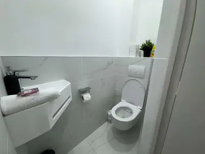 a white bathroom with a toilet in a room at C070 Magnifique appartement au calme 2 Chambre centre in Cannes