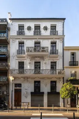 a white building with balconies on the side of it at Suite Carla - Superbe appartement à Cannes in Cannes
