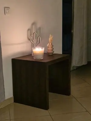 a table with a candle and a cactus on it at Nice & Cosy, 4 pers, 1 bedroom with balcony in Cannes
