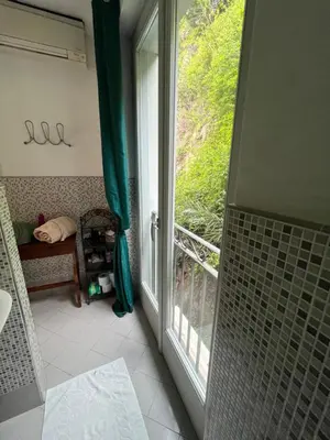 a bathroom with a shower and a large window at Nice & Cosy, 4 pers, 1 bedroom with balcony in Cannes