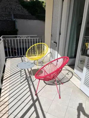 two chairs and a table on a balcony at Nice & Cosy, 4 pers, 1 bedroom with balcony in Cannes