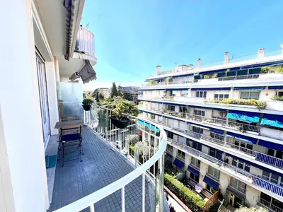 a balcony of a building with a chair on it at B030 Grand studio renove spacieux et lumineux in Le Cannet