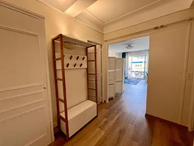 a room with an empty closet with a shelf at B030 Grand studio renove spacieux et lumineux in Le Cannet