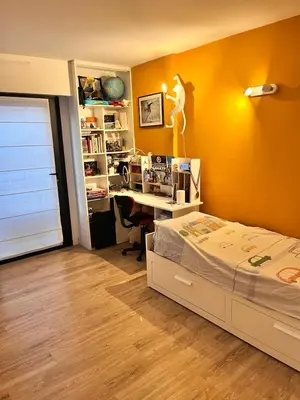 a bedroom with a bed and a desk in it at T3 pièces lumineux à à 1 min de la plage Quartier Palm Beach Cannes in Cannes