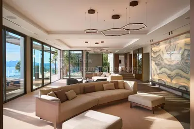 a living room with a couch and tables and windows at Cannes villa 6 chambres - Elisabeth in Cannes
