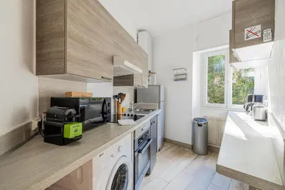 a kitchen with a washer and dryer on a counter at 16 FORV - Apartment for 4 people City center - 300m Palais in Cannes