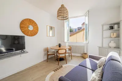 a living room with a couch and a table at 16 FORV - Apartment for 4 people City center - 300m Palais in Cannes