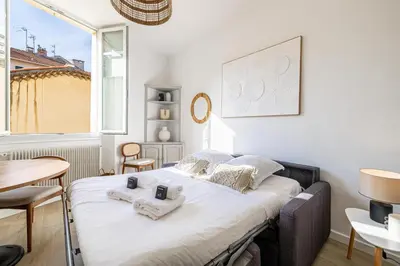 a bedroom with a bed with towels on it at 16 FORV - Apartment for 4 people City center - 300m Palais in Cannes