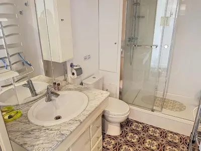 a bathroom with a sink and a shower and a toilet at Studio coeur de Cannes 318L in Cannes