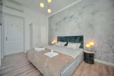 a bedroom with a bed with a cross on it at Oasis du Sud 4 beds and 4 baths 10 min from Palais in Cannes