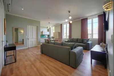 a living room with a couch and a table at Oasis du Sud 4 beds and 4 baths 10 min from Palais in Cannes