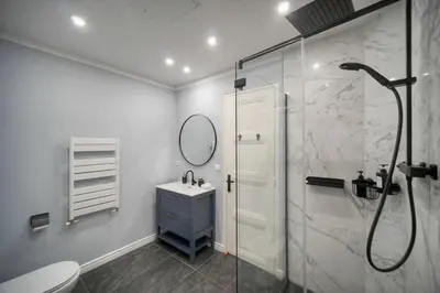 a bathroom with a shower and a toilet and a sink at SEA PEARL Luxury apartament by the Croisette and the beach in Cannes